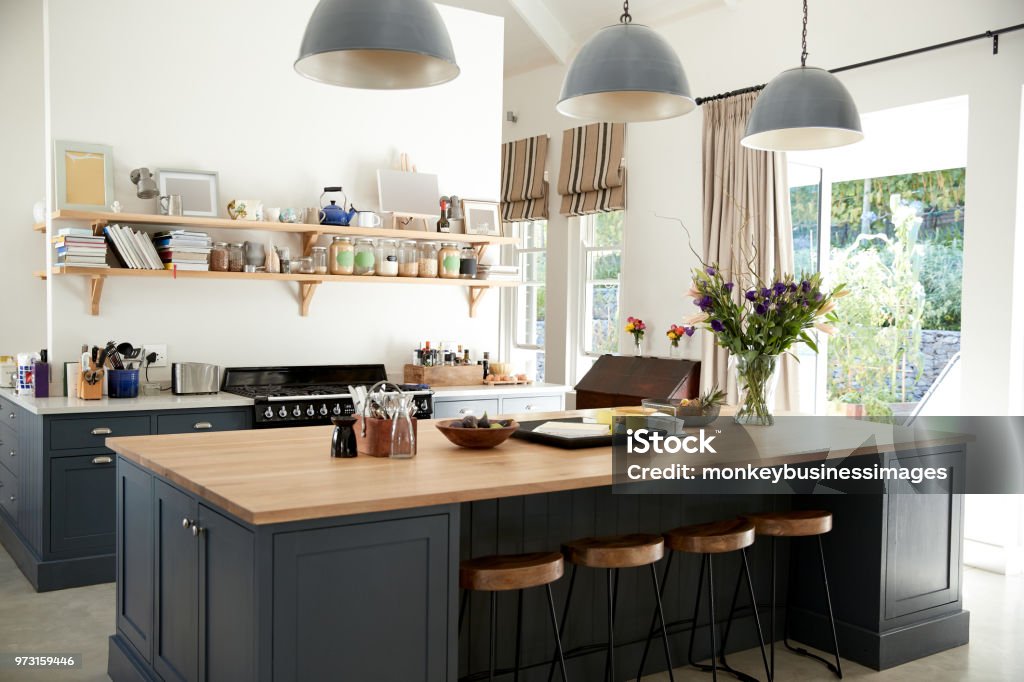 Large family kitchen in period conversion house, angled view Kitchen Island Stock Photo