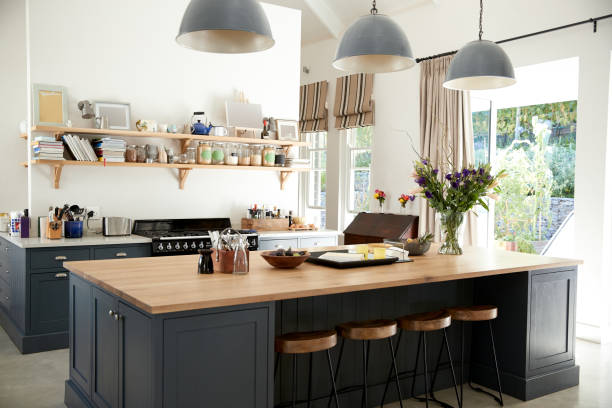 Large family kitchen in period conversion house, angled view Large family kitchen in period conversion house, angled view kitchen island stock pictures, royalty-free photos & images