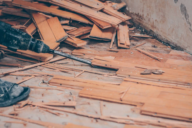 istock Working with a drill puncher breaks the parquet floor 973159500
