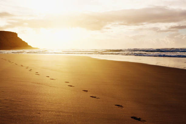 Beautiful remote beach with one person's footprints.