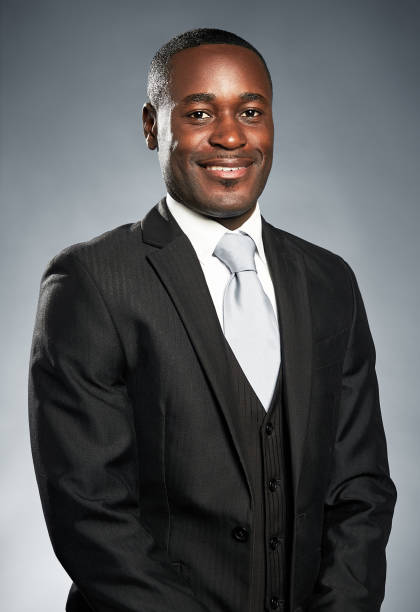 istock Handsome African-American businessman smiles at camera. 973165076