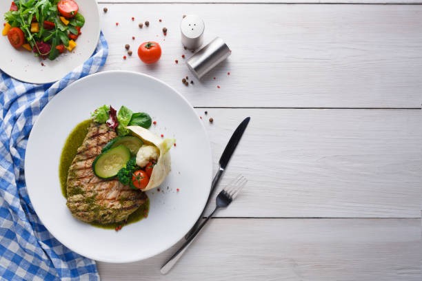 istock Appetizing grilled beefsteak and healthy vegetable salad 973169902