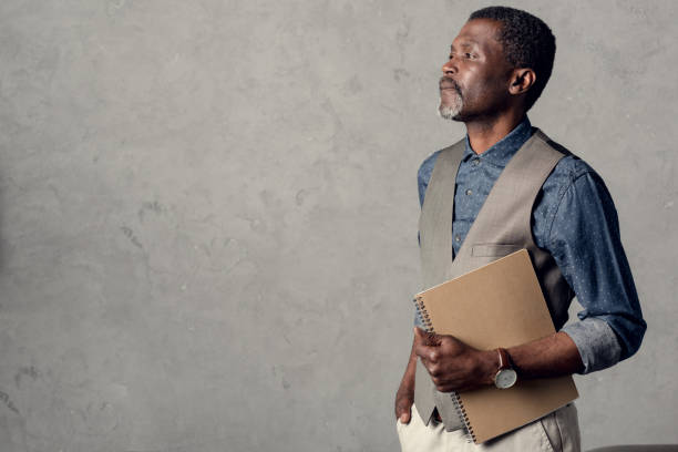 istock handsome middle aged african american businessman with planner 973170330