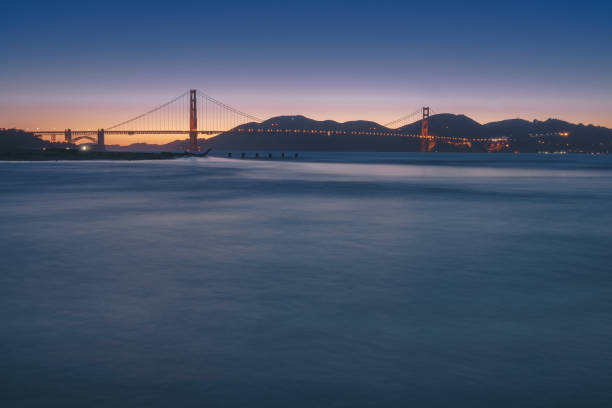 Golden gate bridge twilight time view from Crissy field stock photo