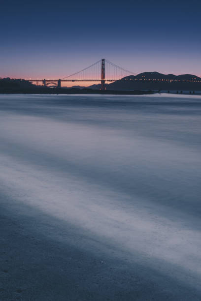 Golden gate bridge twilight time view from Crissy field stock photo