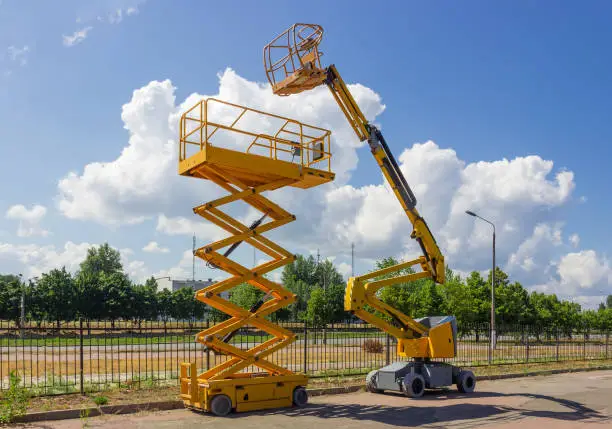 Photo of Self propelled wheeled articulated boom lift and scissor lift