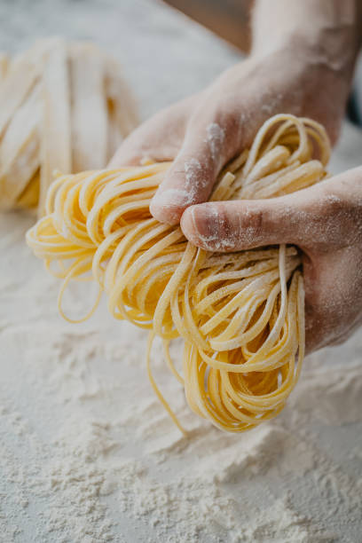 istock Chef making traditional italian homemade pasta 973180788