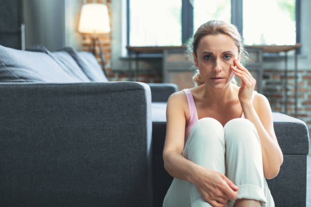 istock Sad mature woman getting bruise 973183774