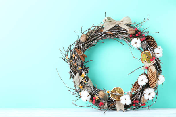 istock Christmas wreath on a green background 973188468