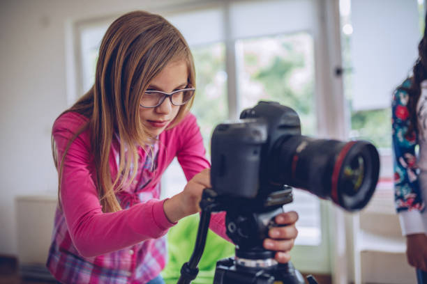 istock Little girl photographer 973190756
