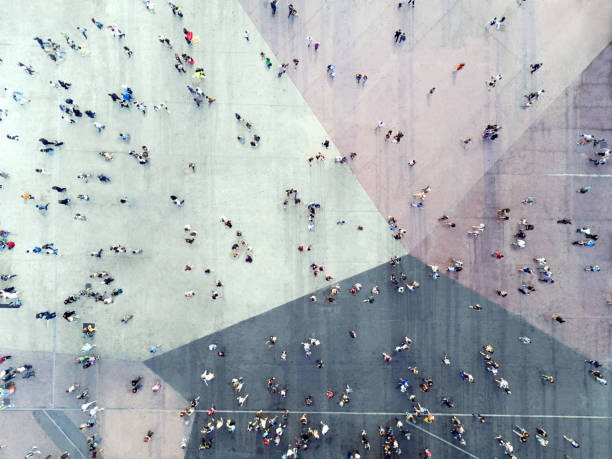 high angle view of menschen auf straße - people walking motion city stock-fotos und bilder