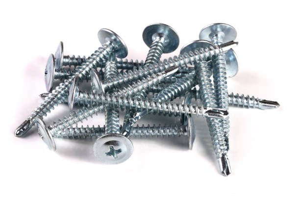istock metal screws isolated on white background closeup 973191288
