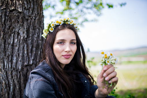 female model photography between flowers