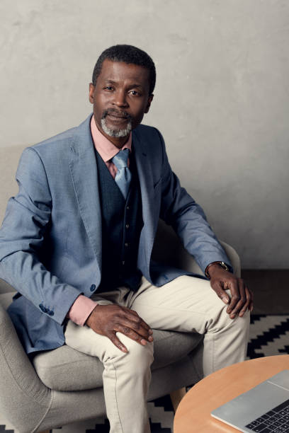 istock middle aged african american businessman in blue jacket 973210120