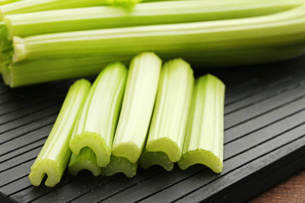 istock Celery on black cutting board 973212554