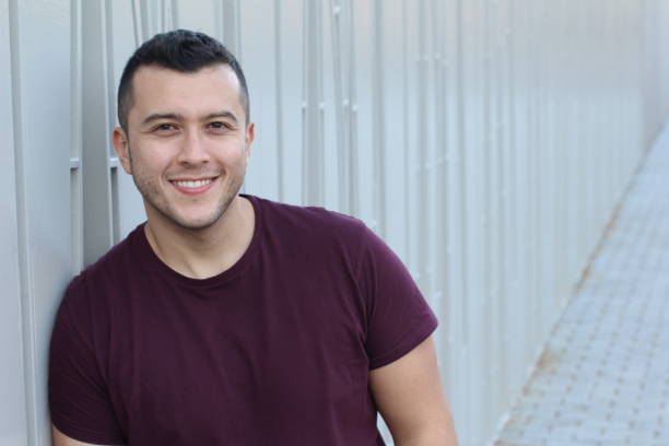 istock Mexican young man smiling with copy space 973212984
