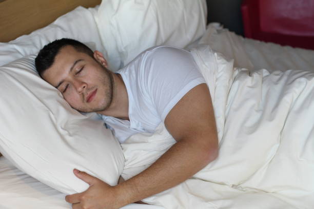 istock Handsome ethnic male sleeping comfortably 973213160