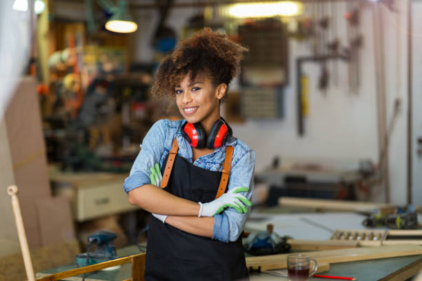 istock Young woman doing woodwork in a workshop 973213176