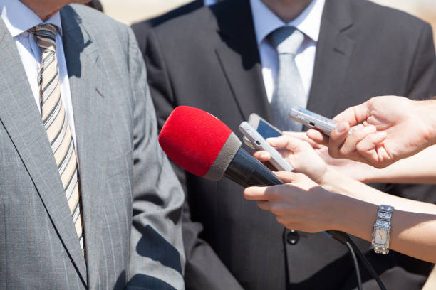 istock Press interview with businessman or politician 973213818