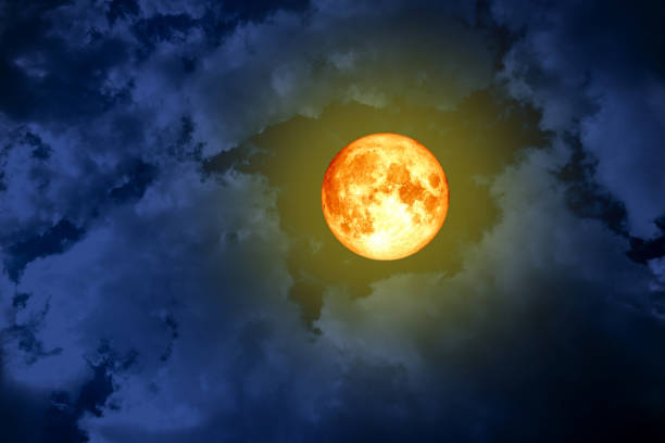 istock full blood moon back space silhouette dark blue cloud on sky 973213848