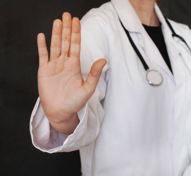 istock Female doctor making stop sign with her hand 973223694