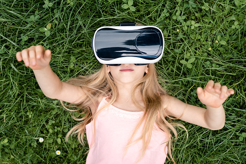 Little girl wearing Virtual reality glasses