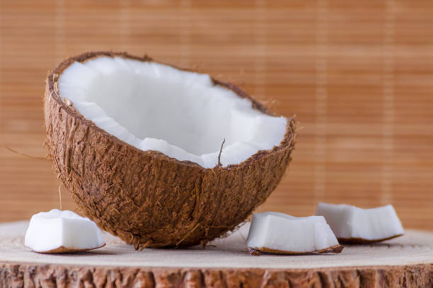 istock a half of coconut and pieces on natural background 973258676
