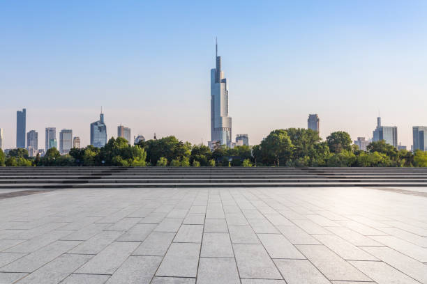 istock Panoramic skyline and modern business office buildings with empty road,empty concrete square floor 973258706