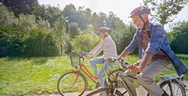 istock Senior couple riding bicycle 973258784