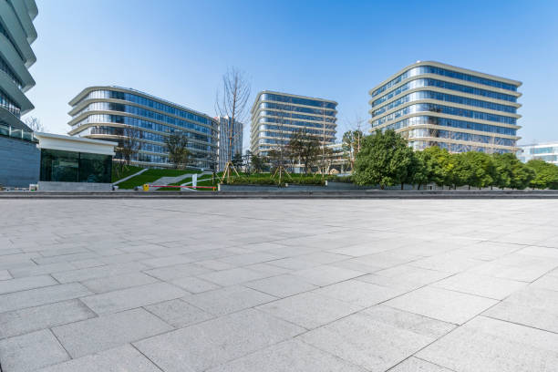 istock Panoramic skyline and modern business office buildings with empty road,empty concrete square floor 973263254