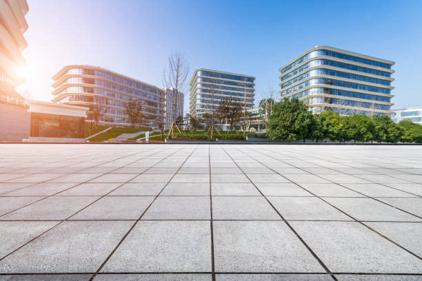 istock Panoramic skyline and modern business office buildings with empty road,empty concrete square floor 973263416