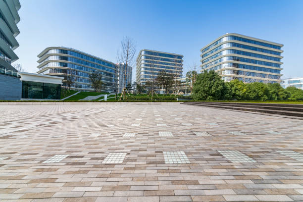istock Panoramic skyline and modern business office buildings with empty road,empty concrete square floor 973265580