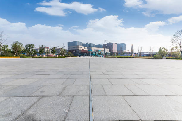 istock Panoramic skyline and modern business office buildings with empty road,empty concrete square floor 973265822