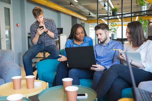 istock Young coworkers in modern office 973265962