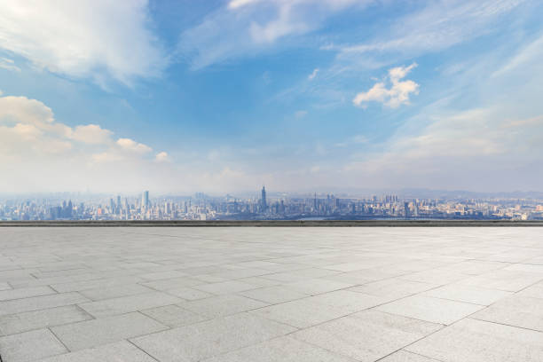 istock Panoramic skyline and modern business office buildings with empty road,empty concrete square floor 973266284
