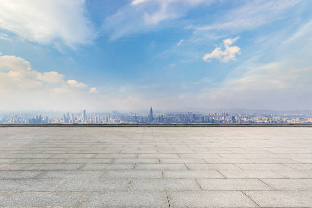 istock Panoramic skyline and modern business office buildings with empty road,empty concrete square floor 973266390