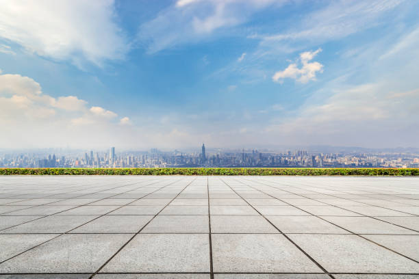 istock Panoramic skyline and modern business office buildings with empty road,empty concrete square floor 973266462
