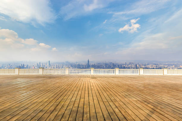 istock Panoramic skyline and modern business office buildings with empty road,empty concrete square floor 973266548