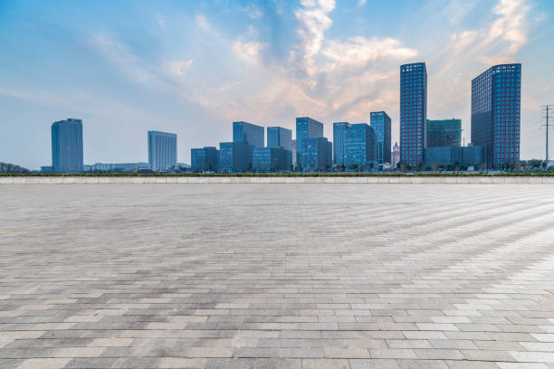 istock Panoramic skyline and modern business office buildings with empty road,empty concrete square floor 973266966