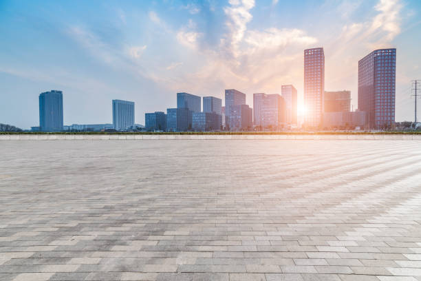 istock Panoramic skyline and modern business office buildings with empty road,empty concrete square floor 973266970