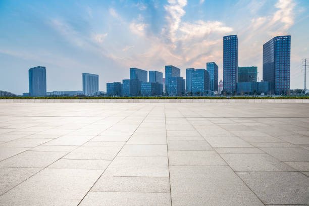 istock Panoramic skyline and modern business office buildings with empty road,empty concrete square floor 973267024