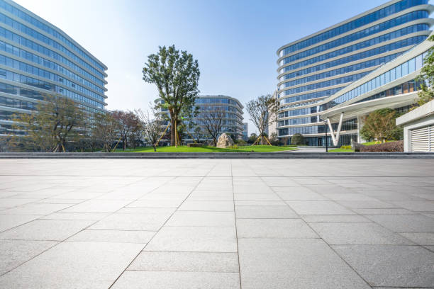istock Panoramic skyline and modern business office buildings with empty road,empty concrete square floor 973267182