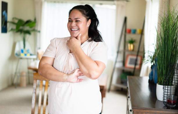 Playful expression of Maori woman.