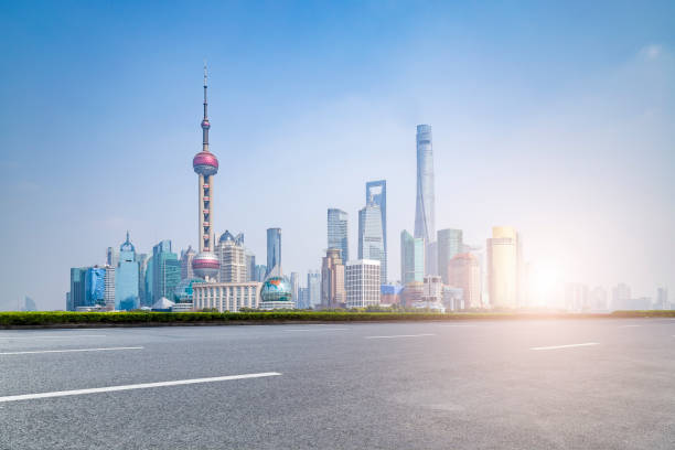 istock Panoramic skyline and modern business office buildings with empty road,empty concrete square floor 973270876