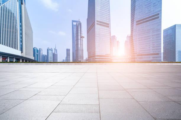 istock Panoramic skyline and modern business office buildings with empty road,empty concrete square floor 973271282