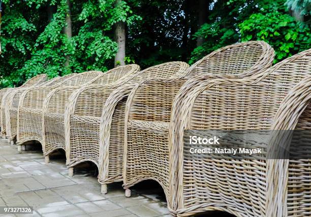 Wicker Chairs In A Row In The Park Stock Photo - Download Image Now - 1980-1989, Architecture, Archival
