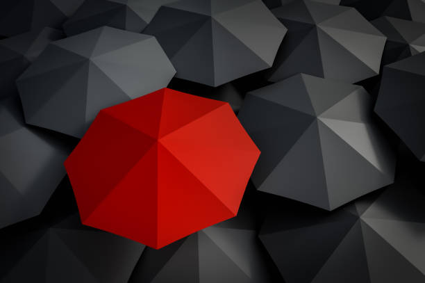 istock Red umbrella and many black umbrellas around 973271656
