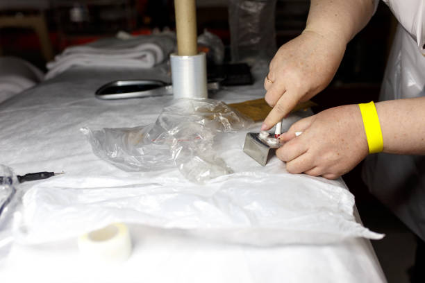istock Woman cleaning tools for professional permanent makeup on medicine table 973271692