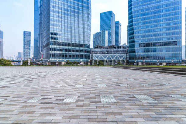 istock Panoramic skyline and modern business office buildings with empty road,empty concrete square floor 973274240