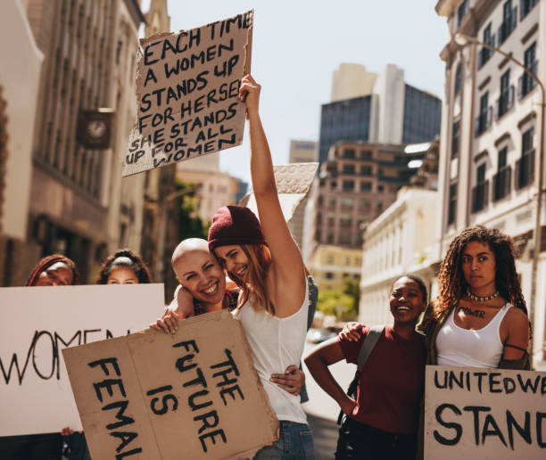 istock Females enjoying at women's march 973274888